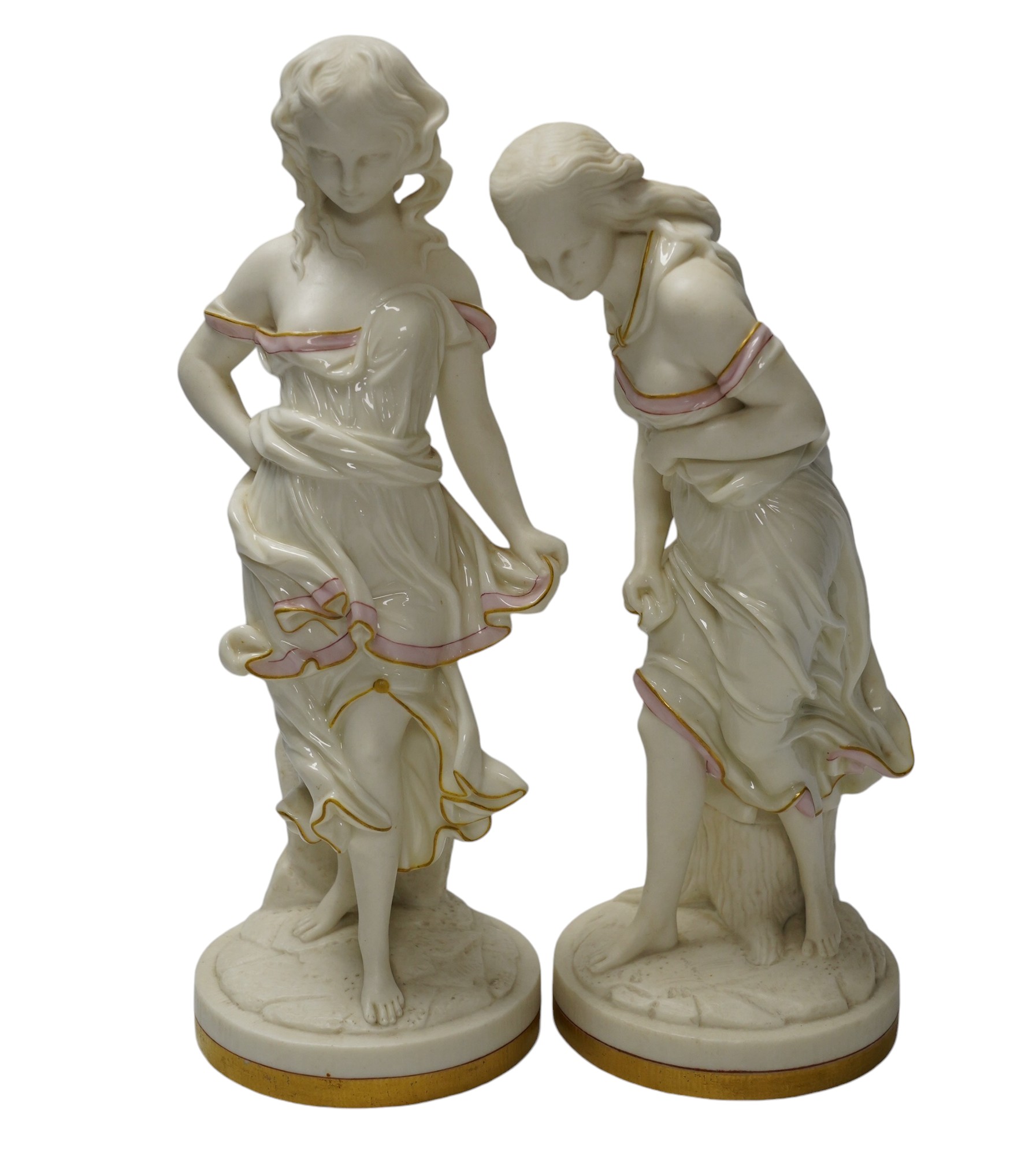 A pair of Worcester partially glazed figurines, 29cm high. Condition - good